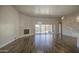 Spacious living room with tile flooring, fireplace, and backyard pool views through sliding glass doors at 710 W Ardmore Rd, Phoenix, AZ 85041