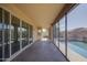Spacious covered patio with views of the sparkling pool, providing a perfect space for relaxation at 710 W Ardmore Rd, Phoenix, AZ 85041
