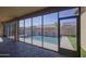 Inviting pool area view from the screened-in patio, ideal for relaxing and entertaining outdoors at 710 W Ardmore Rd, Phoenix, AZ 85041