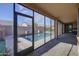 Screened-in patio overlooking a sparkling pool, perfect for enjoying outdoor living and recreation at 710 W Ardmore Rd, Phoenix, AZ 85041