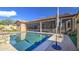 Backyard pool surrounded by a patio, screened in outdoor space, with grass and patio at 710 W Ardmore Rd, Phoenix, AZ 85041