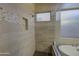 Modern shower featuring neutral tile and accent mosaics and a built-in niche at 710 W Ardmore Rd, Phoenix, AZ 85041
