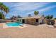 Inviting backyard with a sparkling pool and low-maintenance landscaping at 7940 W Willow Ave, Peoria, AZ 85381