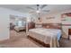Bedroom with mirrored closet doors, dark wood dresser, and cozy quilt on the bed at 7940 W Willow Ave, Peoria, AZ 85381