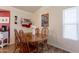 Dining area featuring a wooden table with seating for four at 7940 W Willow Ave, Peoria, AZ 85381