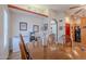 Dining room with a wooden table and chairs, and adjacent refreshments area at 7940 W Willow Ave, Peoria, AZ 85381