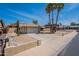 Charming single-story home featuring desert landscaping, a two-car garage, and mature trees accenting the front yard at 7940 W Willow Ave, Peoria, AZ 85381