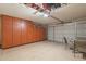 Well-organized garage with built-in storage and space for vehicles at 7940 W Willow Ave, Peoria, AZ 85381