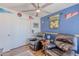 Living room with hardwood floors, a ceiling fan, and natural light at 7940 W Willow Ave, Peoria, AZ 85381