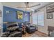 Cozy living room with hardwood floors, ceiling fan, and natural light at 7940 W Willow Ave, Peoria, AZ 85381