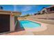 Private pool surrounded by a stone patio, ideal for summer fun at 7940 W Willow Ave, Peoria, AZ 85381