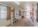Bright sun room with a ceiling fan, multiple windows and sliding glass doors at 7940 W Willow Ave, Peoria, AZ 85381
