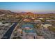 Stunning aerial view of the property showcasing a desirable location near community tennis courts and scenic mountain views at 8540 E Mcdowell Rd # 119, Mesa, AZ 85207