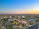Expansive desert community aerial view at sunset with mountain views at 8540 E Mcdowell Rd # 119, Mesa, AZ 85207