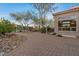 A brick patio complements the exterior of the home, creating an inviting outdoor living space at 8540 E Mcdowell Rd # 119, Mesa, AZ 85207