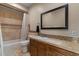 A bathroom featuring a shower/tub, tiled floor, vanity, mirror and neutral paint at 8540 E Mcdowell Rd # 119, Mesa, AZ 85207