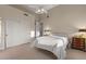 This spacious bedroom features an ensuite bath, closet and ceiling fan at 8540 E Mcdowell Rd # 119, Mesa, AZ 85207