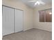 Cozy bedroom features neutral carpet and a double door closet at 8540 E Mcdowell Rd # 119, Mesa, AZ 85207