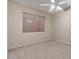 Neutral bedroom featuring plush carpeting, a window, and bright overhead lighting at 8540 E Mcdowell Rd # 119, Mesa, AZ 85207