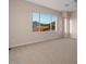 A large bonus room featuring neutral paint and a large multi-pane view window at 8540 E Mcdowell Rd # 119, Mesa, AZ 85207