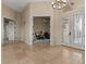 An entryway featuring tile floors, a decorative chandelier, and a glass paneled double door at 8540 E Mcdowell Rd # 119, Mesa, AZ 85207