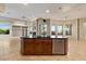 Kitchen island with a dark countertop and stainless steel dishwasher in a large room at 8540 E Mcdowell Rd # 119, Mesa, AZ 85207