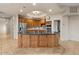 Spacious kitchen featuring wood cabinets, stainless steel appliances, and a center island at 8540 E Mcdowell Rd # 119, Mesa, AZ 85207