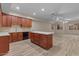 Open kitchen with shaker cabinets, center island and stainless sink at 8540 E Mcdowell Rd # 119, Mesa, AZ 85207