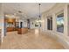 Open-concept living space showcasing the kitchen with an island and a dining area with large windows at 8540 E Mcdowell Rd # 119, Mesa, AZ 85207