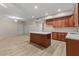 Bright kitchen with shaker cabinets and center island at 8540 E Mcdowell Rd # 119, Mesa, AZ 85207