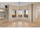 Living room boasting a wall of windows with natural light and neutral walls at 8540 E Mcdowell Rd # 119, Mesa, AZ 85207