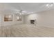 Living room features neutral fireplace and new flooring at 8540 E Mcdowell Rd # 119, Mesa, AZ 85207