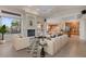 Bright living room featuring a fireplace, plush seating, and an open floor plan at 8540 E Mcdowell Rd # 119, Mesa, AZ 85207