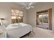A main bedroom with a window view and sliding door access to the patio at 8540 E Mcdowell Rd # 119, Mesa, AZ 85207