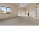 Spacious main bedroom with tray ceiling, ceiling fans, and large windows offering scenic views at 8540 E Mcdowell Rd # 119, Mesa, AZ 85207