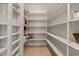 Walk-in pantry featuring ample shelving space for organized food storage, keeping the kitchen clutter-free at 8540 E Mcdowell Rd # 119, Mesa, AZ 85207