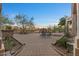 Expansive brick patio with an outdoor fireplace, perfect for entertaining or enjoying a quiet evening at 8540 E Mcdowell Rd # 119, Mesa, AZ 85207