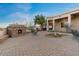 A stone fireplace on brick patio extends leisure living to the outdoor entertaining space at 8540 E Mcdowell Rd # 119, Mesa, AZ 85207