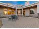 Private outdoor space with brick patio and a seating arrangement offer a relaxing environment at 8540 E Mcdowell Rd # 119, Mesa, AZ 85207