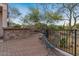 A brick patio with lounge furniture provides a place to relax and enjoy the beautiful views at 8540 E Mcdowell Rd # 119, Mesa, AZ 85207