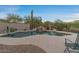 The backyard with private pool offers a tranquil escape with lush desert landscaping and serene views at 8540 E Mcdowell Rd # 119, Mesa, AZ 85207