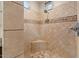 Tiled shower with corner seat, offering a spa-like experience with attention to detail in design and functionality at 8540 E Mcdowell Rd # 119, Mesa, AZ 85207