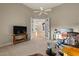 Sitting room with access to the entryway, furnished with armchairs, a desk, and a TV at 8540 E Mcdowell Rd # 119, Mesa, AZ 85207
