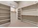 Large walk-in closet with custom shelving for organized storage, creating a personalized dressing space at 8540 E Mcdowell Rd # 119, Mesa, AZ 85207