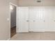 Neutral carpeted bedroom features neutral paint, sliding closet doors, and ample closet space at 10130 E San Salvador Dr, Scottsdale, AZ 85258
