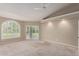 Spacious bedroom featuring a ceiling fan, neutral walls, and slider to backyard at 10130 E San Salvador Dr, Scottsdale, AZ 85258