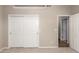 Neutral carpeted bedroom features neutral paint, sliding closet doors, and ample closet space at 10130 E San Salvador Dr, Scottsdale, AZ 85258