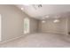 Spacious bedroom with vaulted ceiling, carpeted floors, and natural light from arched windows at 10130 E San Salvador Dr, Scottsdale, AZ 85258