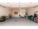 Spacious garage with epoxy floors, built-in cabinets, and ample storage at 10130 E San Salvador Dr, Scottsdale, AZ 85258