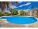 Serene backyard with a refreshing pool, spa, and lush landscaping for outdoor enjoyment at 10130 E San Salvador Dr, Scottsdale, AZ 85258